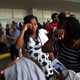 Two women cry after arriving at the Port of Palm Beach on the cruise ship Grand Celebration Sept. 7, 2019, in West Palm Beach, Fla. The ship arrived with hundreds of evacuees impacted by Hurricane Dorian in the Bahamas.